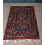A handwoven Celtic patterned rug. L: 150cm, W: 90cm. Condition good.