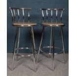 Two metal framed bar / kitchen stools with a circular wooden seat. H: 97cm, W:41cm