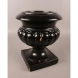 A large black pottery pedestal planter/font. (Height 30cm).