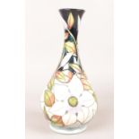 A Moorcroft vase, decorated with Clematis flowers and foliage, boxed. H:23.5cm. Condition good