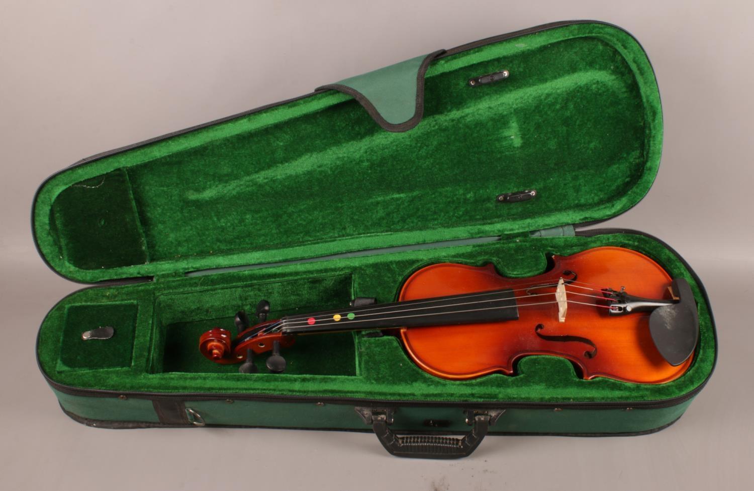 A 'Antoni' Debut 3/4 Violin, comes in green velvet lined case, label to interior. Total length: