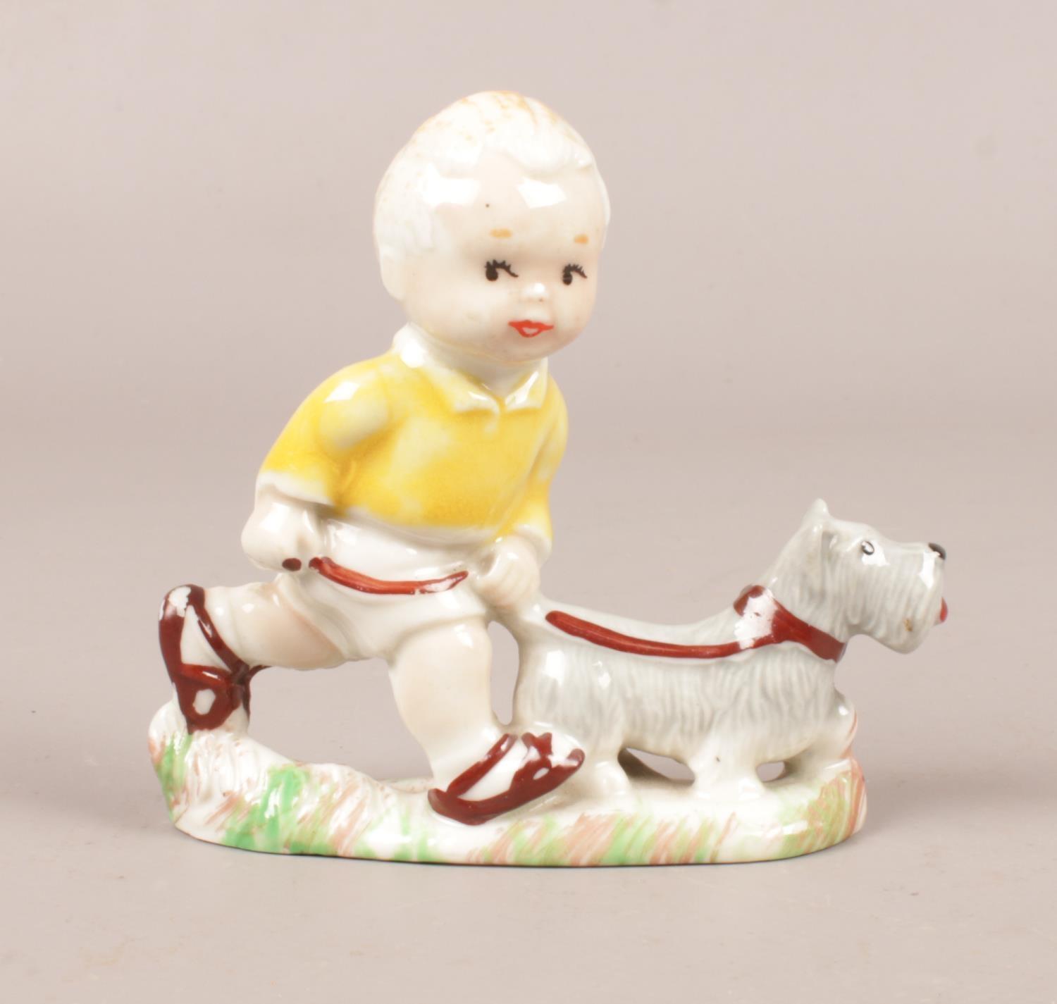 A Wade Mabel Lucie Attwell figure. Sarah with pet dog, Height 8cm.