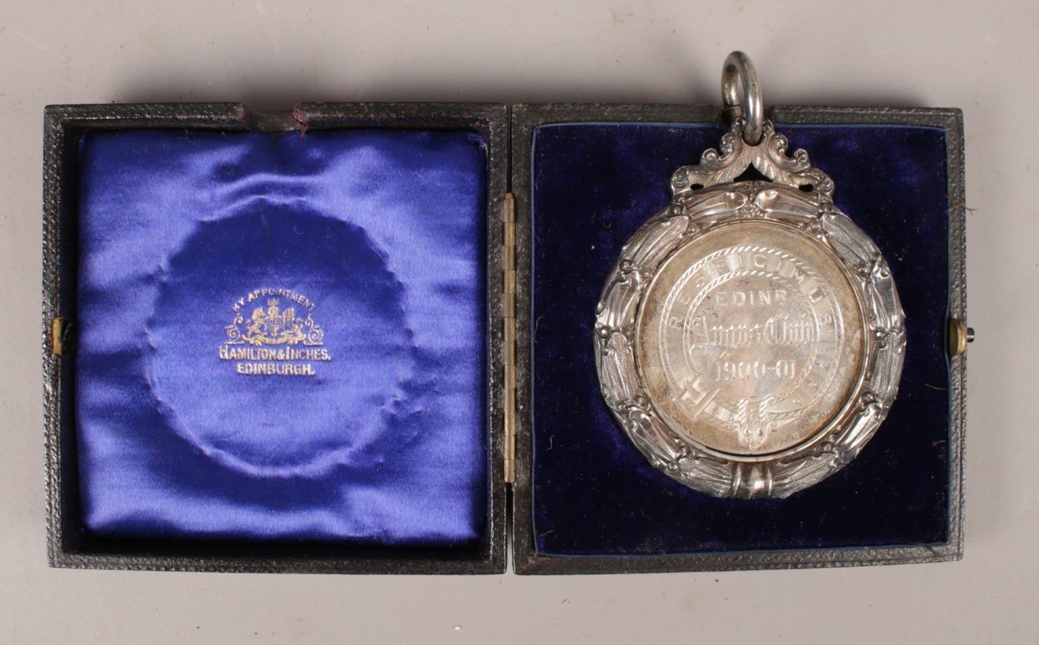 The Edinburgh Angus Club presentation medal 1900-1901. In fitted leather case, by Hamilton & Inches.