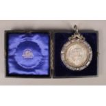 The Edinburgh Angus Club presentation medal 1900-1901. In fitted leather case, by Hamilton & Inches.