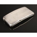 A George V silver card case. Assayed Chester 1919 by Stokes & Ireland Ltd. Hinge closes. Dent to