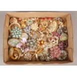 A box of 43 vintage costume brooches. Including coloured paste examples etc. Brooches in good