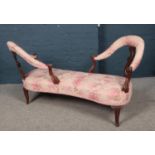 A 19th Century carved mahogany conversation seat. Missing part of one leg.