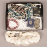 A tray of costume jewellery to include mother of pearl necklace, haematite beads, filigree brooch,