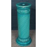 A Burmantofts turquoise pottery jardinière stand with floral decoration. (63cm). Cracked and