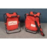 Two Royal Canin foldable stools.