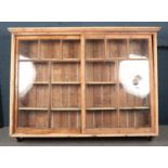A Victorian large pine wall shelving unit with sliding glass front doors. (148cm x 193cm x 41cm)