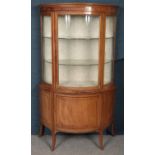 An Edwardian stripped pale mahogany dome front display cabinet. (182cm x 106cm x 47cm) Cracked to