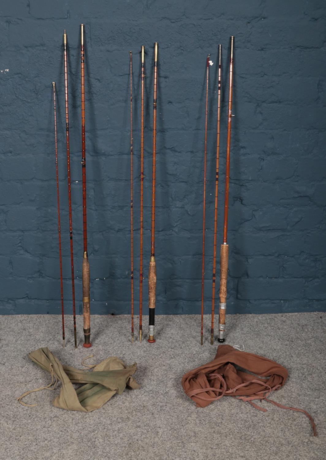 Three vintage split cane fishing rods. Includes J.A Walker, Eaton & Deller example in canvas bag and