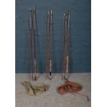 Three vintage split cane fishing rods. Includes J.A Walker, Eaton & Deller example in canvas bag and