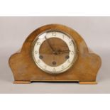 A carved Oak eight day dome top Westminster/Whittington chime mantle clock