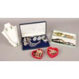 A quantity of costume jewellery to include necklaces, beads, clip on earrings, brooches, etc.