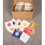 A box of single records. Mainly 1970s examples.