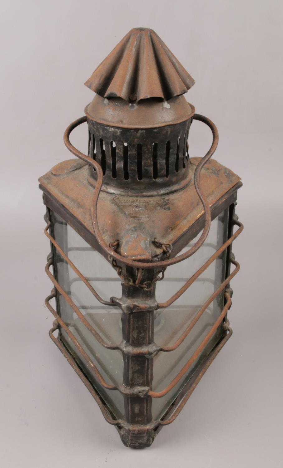 A 19th century oil lantern of triangular form, by John Evitt London. Chip to bottom edge of one