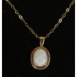 A 9ct gold opal pendant on chain.