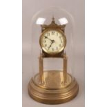 A Gustav Becker brass torsion clock under glass dome. (approximately 29cm). Missing pendulum.