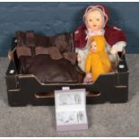 A box of miscellaneous. Including brown leather handbag, soft body dolls, jewellery set, etc.