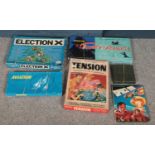 A box of board games. Including Election X, Tension, annuals, etc.