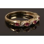 A 9ct gold ruby and diamond ring. Size O. Weight 2.17g.