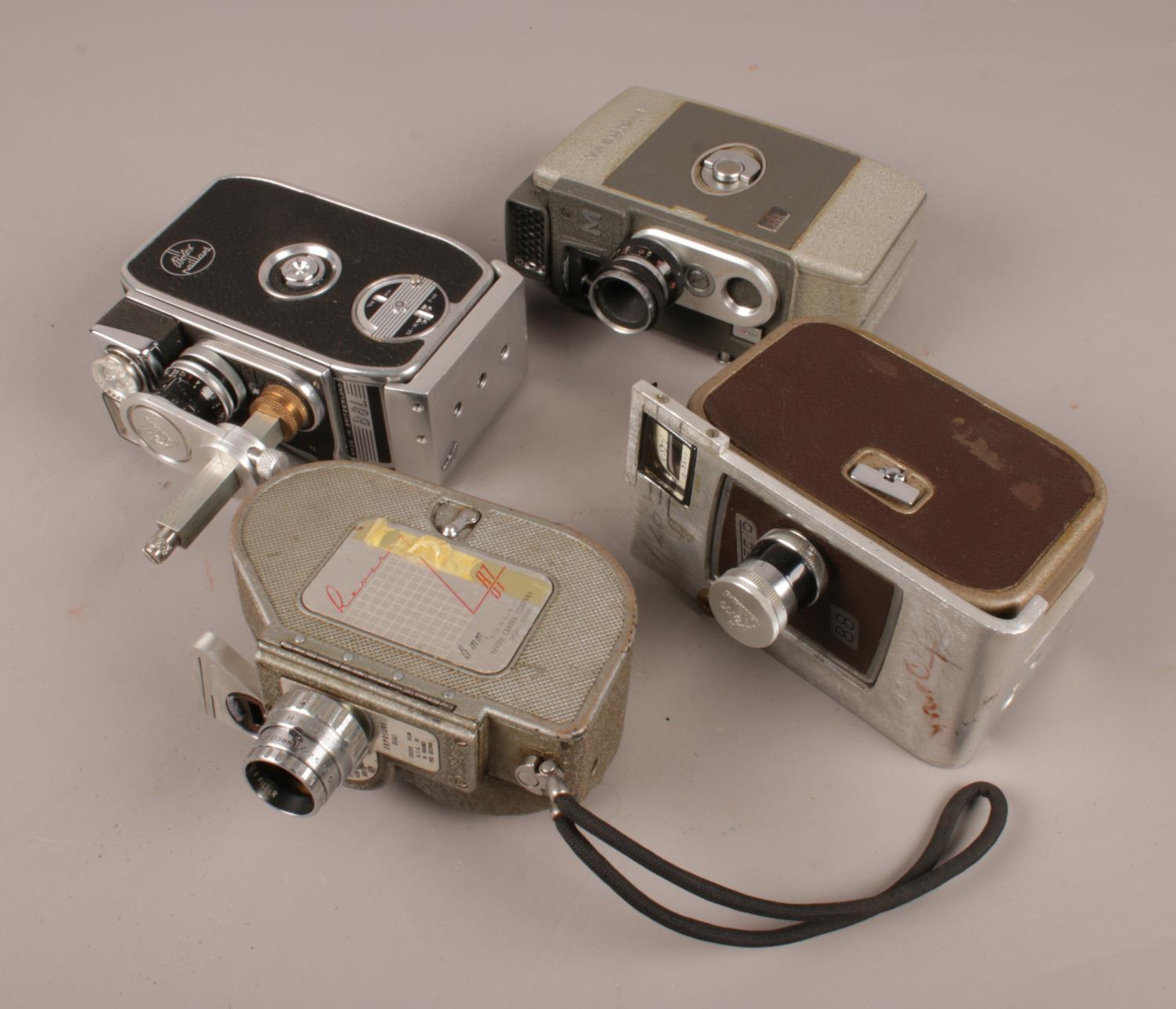 Four vintage cine cameras. Includes Bolex Paillard B8L, Specto 88, Revere and Yashica-M.