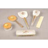 A group of dressing table accessories, hairbrush, hand mirror, clothes brush examples etc