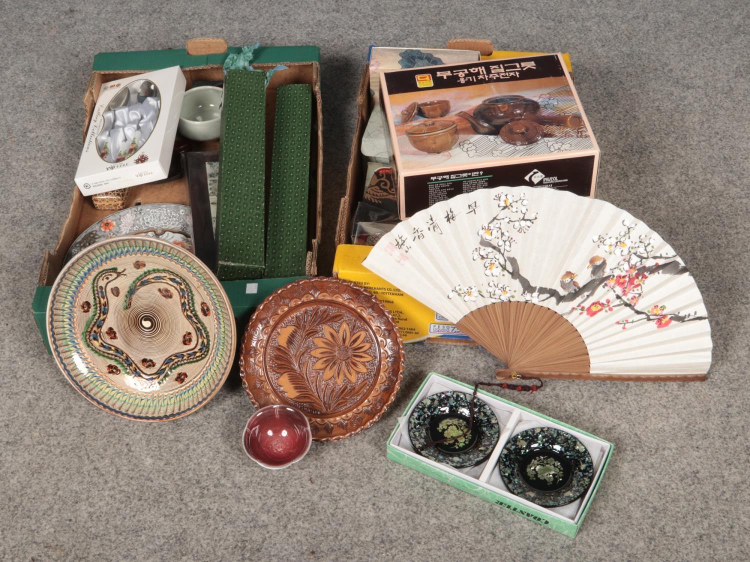 Two boxes of miscellaneous Oriental wares. Hand fan, Cutlery collection spoon & chopsticks set (