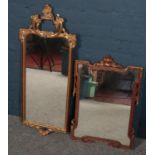 Two ornate gilt framed wall mirrors.