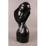 A carved wooden art deco style bust of a woman. H: 48cm, W: 18cm. There are minor scuffs and chips.
