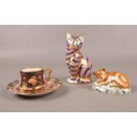 A group of Royal Crown Derby. Imari cat (height 13cm) & Lion cub MMVII with a silver stopper (height