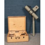 A large Telescope/Theodolite in a wooden carry case. Case: H: 47cm, W:56cm, D: 20cm.