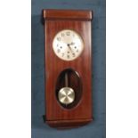 A mahogany cased Enfield wall clock. Pendulum and key.