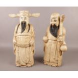 Two Oriental carved & painted wooden figures. H: 38cm, W: 15cm. Condition fair - head dress is