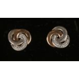 A pair of 14ct gold and silver Pandora ear studs.