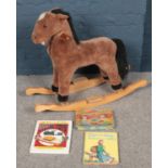 An A&A soft toys rocking horse along with metal toys guide book, etc.