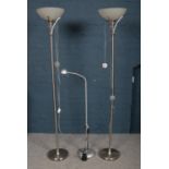 Three floor lamps - comprising of two nickel coloured floor lamps with glass shade uplighters,