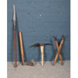 A collection of vintage maintenance tools. To include: axe, hedge slasher and pick axe etc.