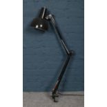 A vintage clamp on Anglepoise Lighting Ltd task lamp with black enamel shade.