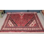 A full pile hand woven Persian Saruq village carpet. (315cm x 210cm).