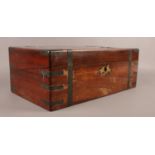 A Victorian Mahogany writing slope, with brass mounts to the corners, straps and decoration to the