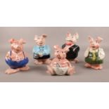 A set of five Wade Natwest pig money boxes. Pig with suit has chip to foot.