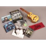 A collection of The Beatles related items. Includes pencil case, holographic medallions, CDs etc.