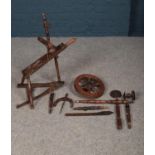 A wooden turned spinning wheel, currently dismantled. Please note that this spinning wheel has