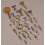 A quantity of assorted clock and pocket watch keys.