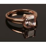 A 9ct rose gold ring set with pale pink square cut gemstone. Size K. Weight 1.90g.