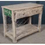 A painted side table/hall table with cast iron grill back and mounted tin enamel plate. (76cm x 94cm