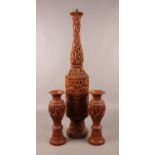 A large decorative wooden table lamp base, along with two similar vases. (Height of table lamp